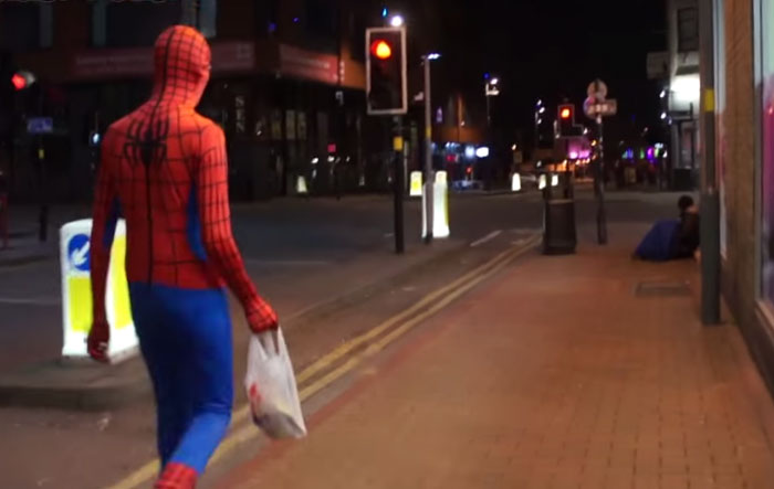 Anonymous Spiderman feed homeless at night - GeorgianJournal