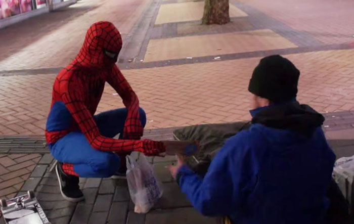 Anonymous Spiderman feed homeless at night - GeorgianJournal