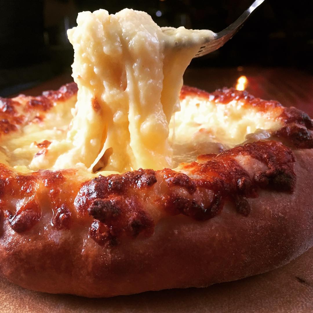 cheese boat Adjaruli Khachapuri New York Essential Dish